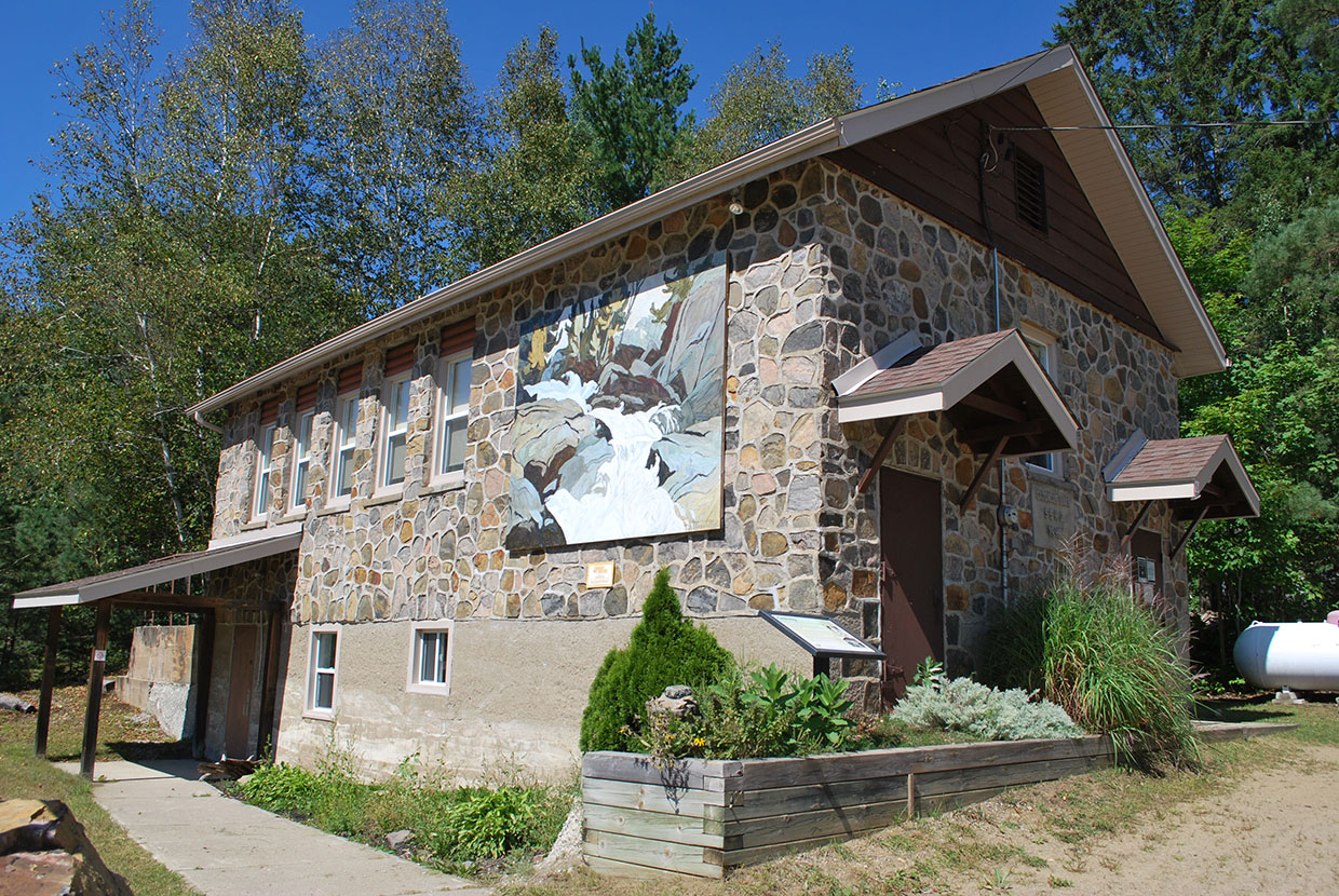 Image shows the Oxtongue Lake Community Centre, which is a stone building and former school house