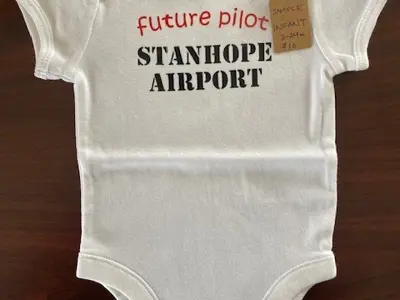 Image shows a baby onesie. 