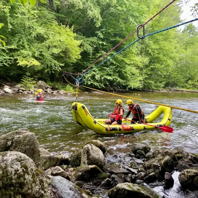 Image shows firefighters conducting swift-water training. 