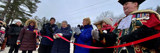 Image shows the mayor and other dignitaries cutting the ceremonial ribbon at the Dorset Snow Ball Winter Carnival. 