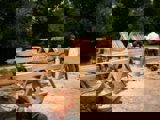 Image shows men working with large timbers. 