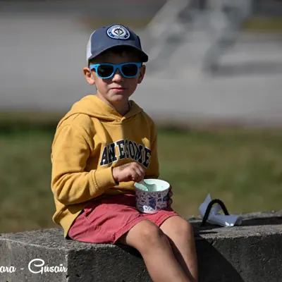Image shows a child enjoying the fly-in.